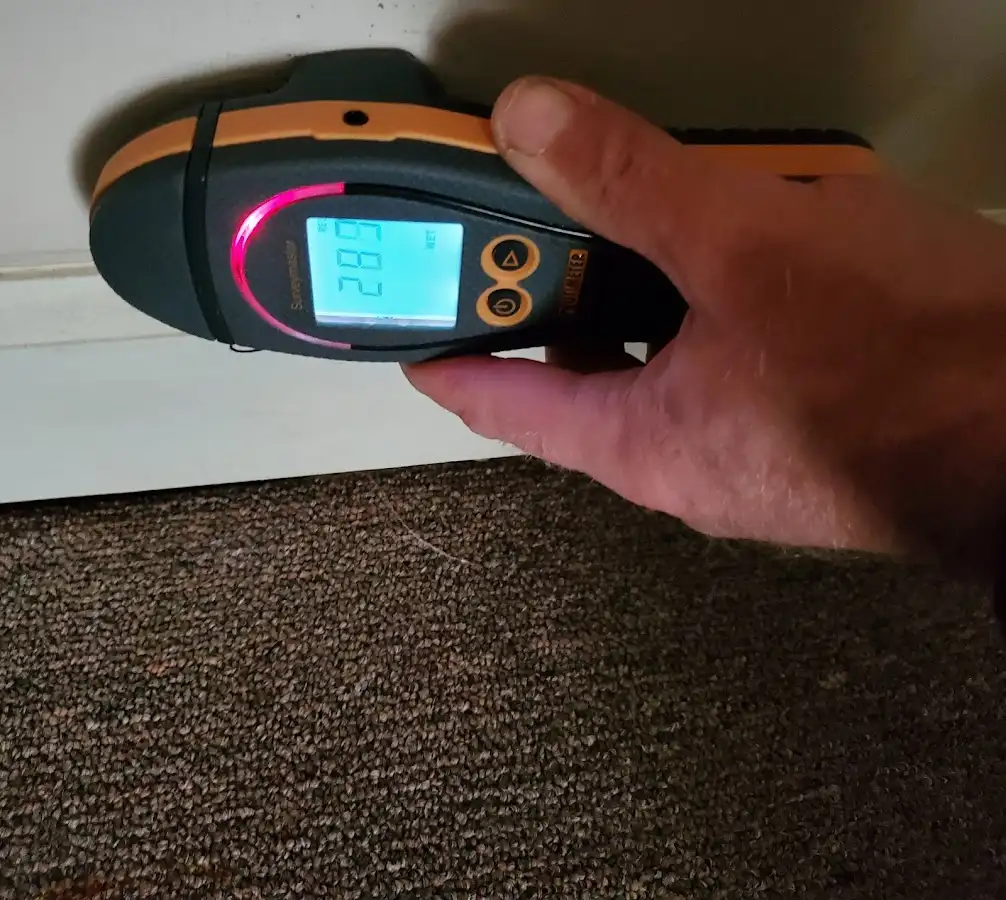 Moisture detection at baseboard during Storm Damage Restoration in Dublin
